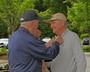 Post 370 Legionnaire Bill Edwards pins on a poppy.